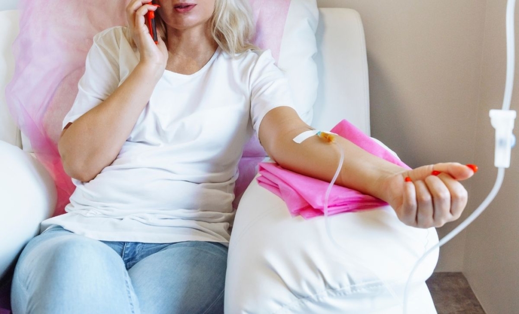 woman receiving NAD+ IV therapy in a clinical setting.