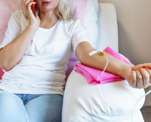 woman receiving NAD+ IV therapy in a clinical setting.