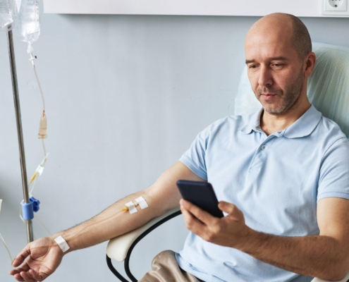 a man taking IV Hydration therapy to boost wellness and hydration.